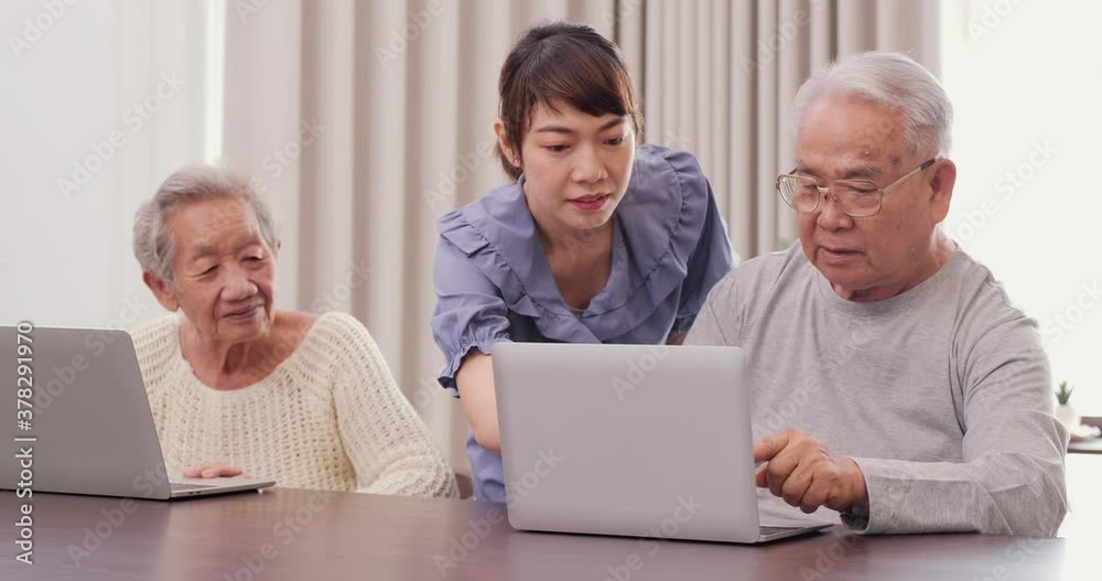Beautiful young woman teaching father and mother to use computer at home. Lifestyle and Technology concept. Beautiful young woman teaching father and mother to use computer at home. Lifestyle and Technology concept.