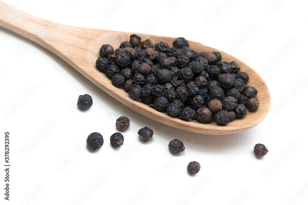 Black Pepper grains on wooden spoon. Black Pepper grains on wooden spoon.