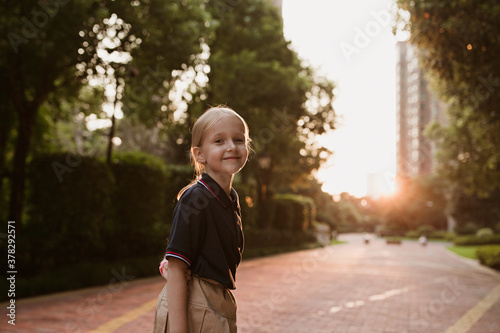 Back to school. Little girl from elementary school outdoor. Kid going learn new things 1th september