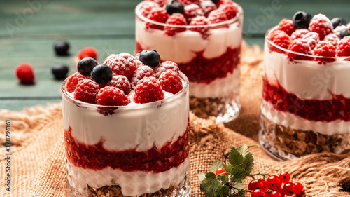 Parfait with granola, berries and whipped cream. fresh raspberry dessert, catering, banner menu recipe place for text