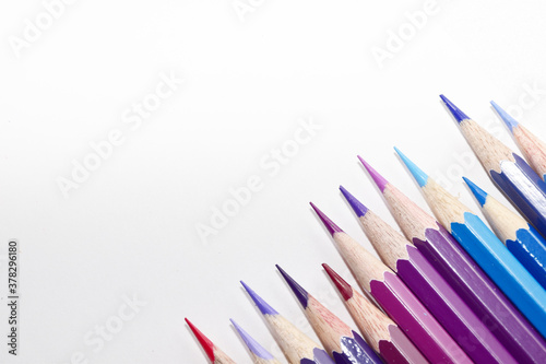 Many Color pencils isolated on white background close up. Color pencils for drawing as a background