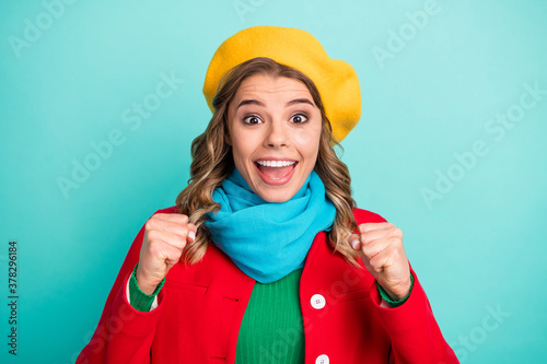 Portrait of astonished positive girl impressed season winter sale lottery raise fists scream enjoy rejoice wear green jumper isolated over teal color background