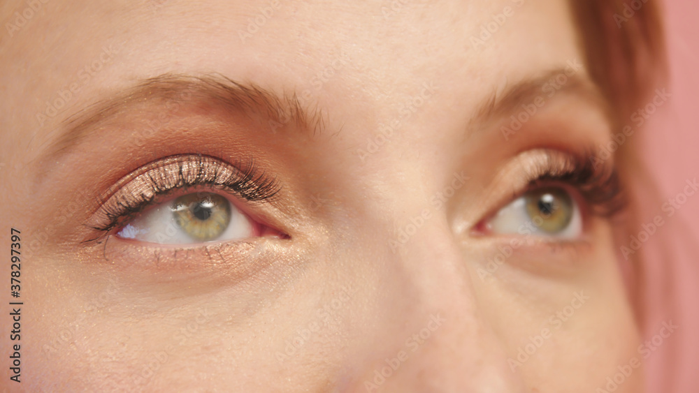 © CameraCraft - close up face of pretty girl with beautiful big green eyes, big eyelashes and eyebrows. High quality photo