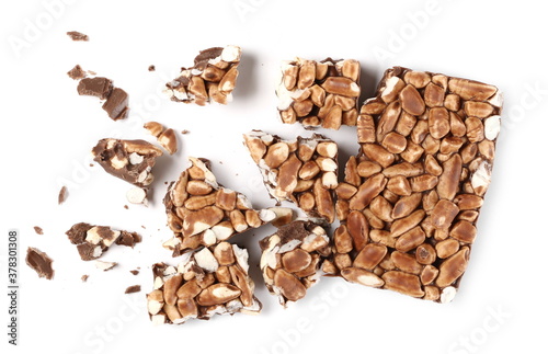 Rice chocolate, crunch bar broken into pieces, chunks isolated on white background, top view