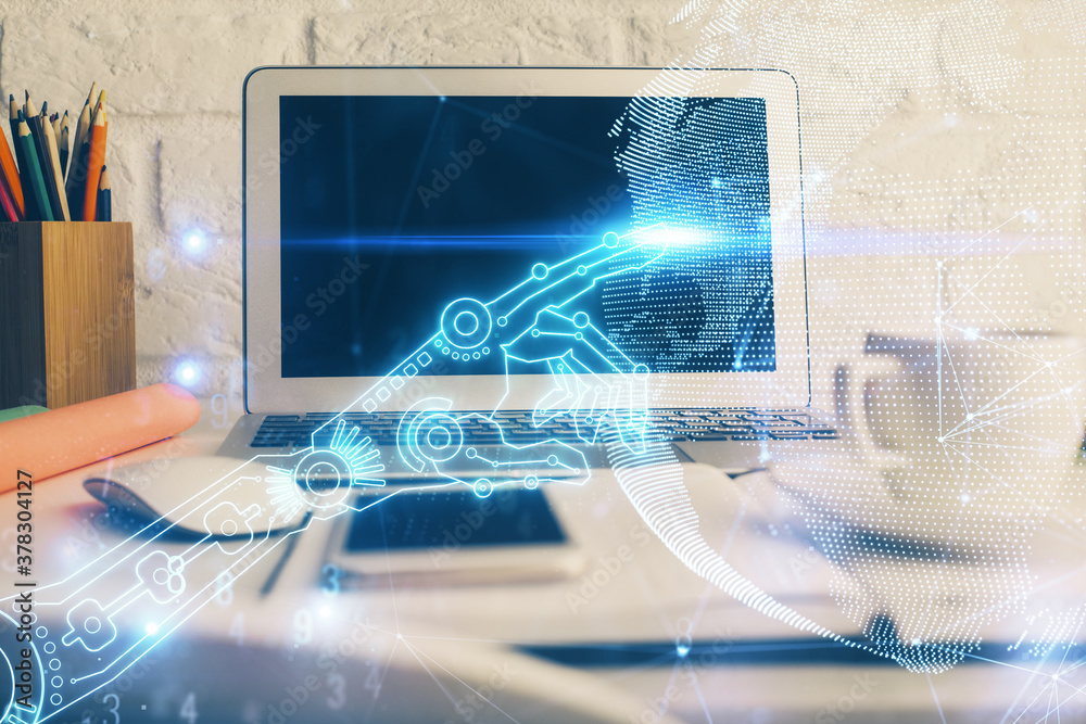 Computer on desktop in office with technology theme hologram. Double exposure. Tech concept. Computer on desktop in office with technology theme hologram. Double exposure. Tech concept.