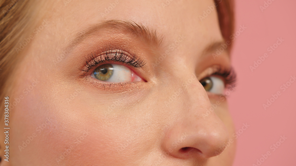 Fototapeta premium Close up of green eyes of a spy woman. High quality photo