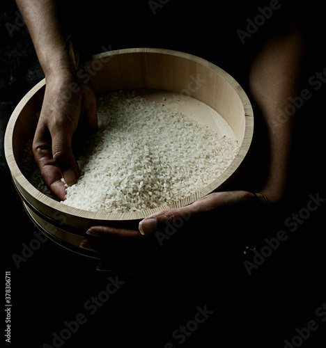 Plain rice in a typical Japanese wooden tub hangiri photo