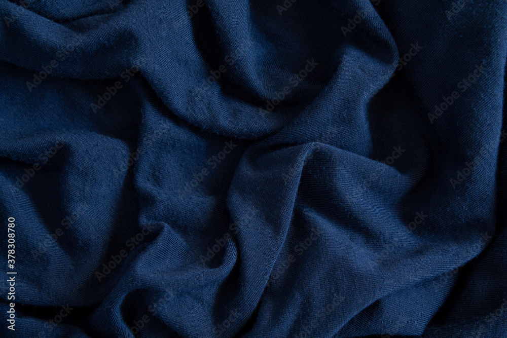 Crumpled blue satin fabric. Texture Crumpled blue satin fabric. Texture