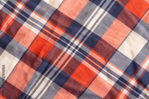Texture of red fabric in a cage