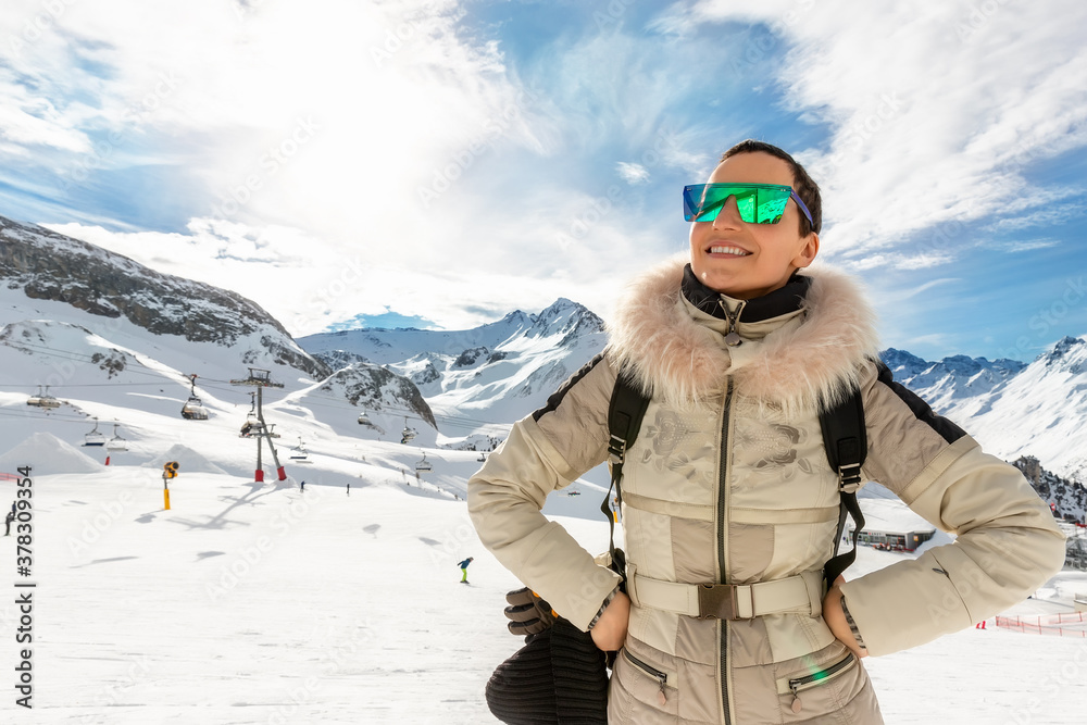 Young adult beautiful happy attractive caucasian smiling hiker woman leaping jumping high like star against skiing resort panorama breathtaking view. Winter travel welcome concept. copy space