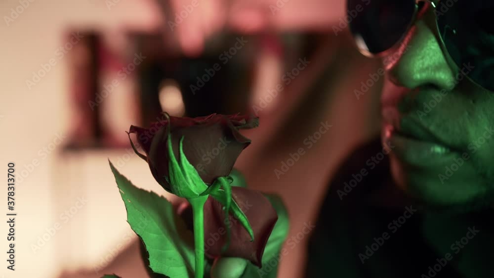Bravo Throwing Roses Black man plucking red rose petals & throwing them away, partial face ...
