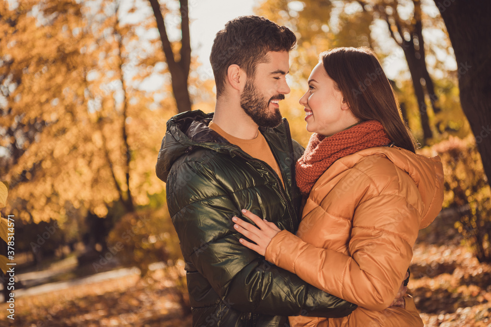 Photo of bonding couple guy embrace cuddle his girlfriend in outside autumn town park wear season coat Photo of bonding couple guy embrace cuddle his girlfriend in outside autumn town park wear season coat