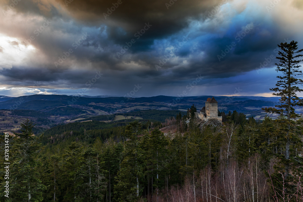 The old dilapidated castle of Kasperk in the Czech Republic just before the spring storm