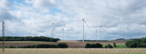 fields and wiind turbines in german eifel