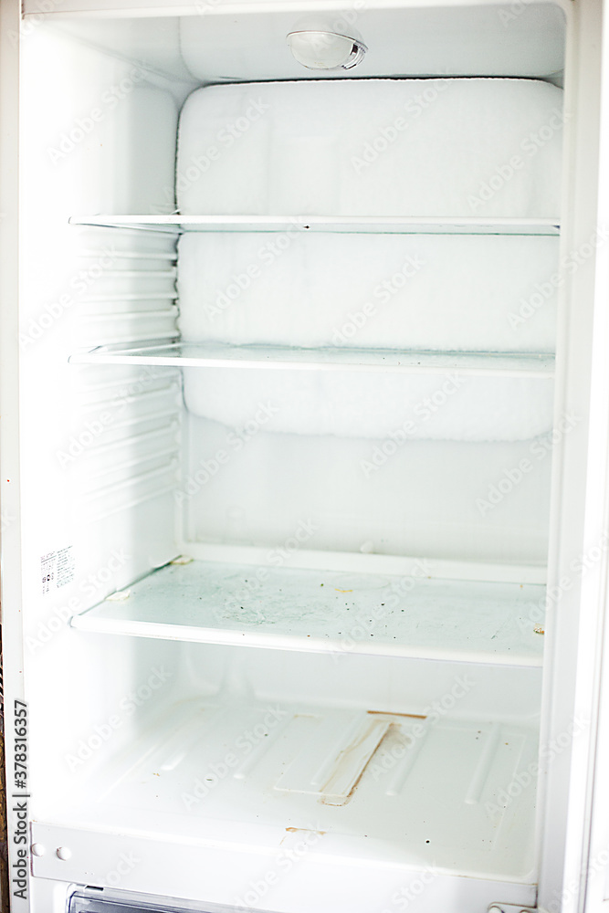 Broken fridge. defrosted refrigerator. Open freezer Broken fridge. defrosted refrigerator. Open freezer