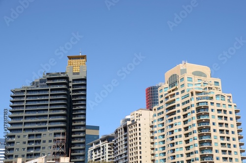 Inner city apartments in the skyline against a deep blue sky in Sydney Australia
