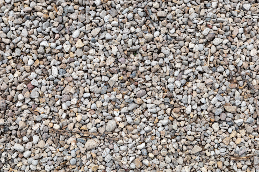 Top view of textured yellow and white pebble stones ground Top view of textured yellow and white pebble stones ground