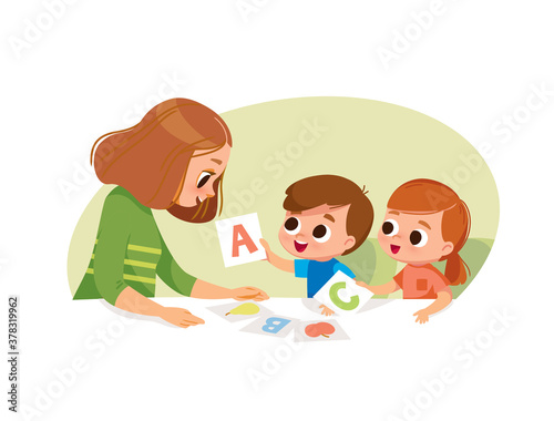 Children two kids learning letters with mother teacher. Learning alphabet with flashcards cards. Early education.