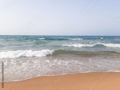  Close-up soft wave of the sea on the sandy beach 