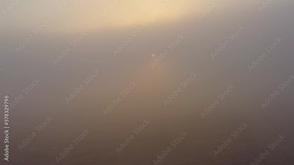 Flying through heavenly beautiful sunny cloudscape. fluffy clouds moving softly on the sky and the sun shining Flying through heavenly beautiful sunny cloudscape. fluffy clouds moving softly on the sky and the sun shining