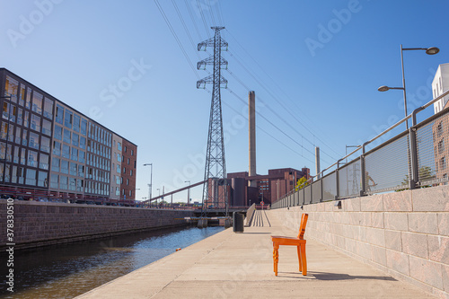 Golden chair in the street. Public bench