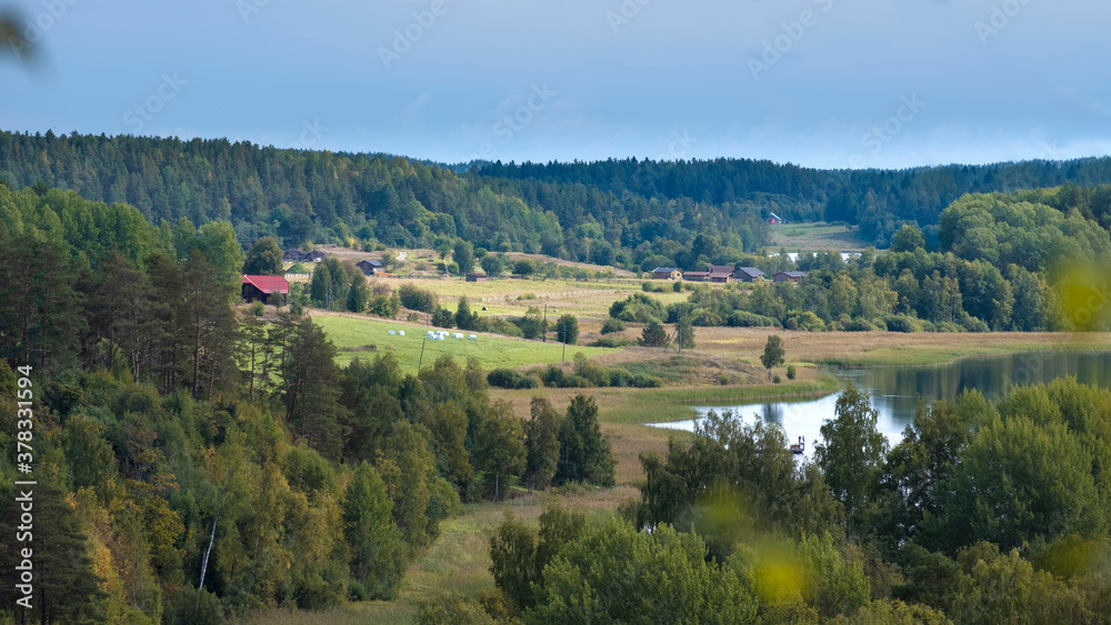 View from Khiitolskie Rocks in the Republic of Karelia in early autumn. Northern Russia landscape