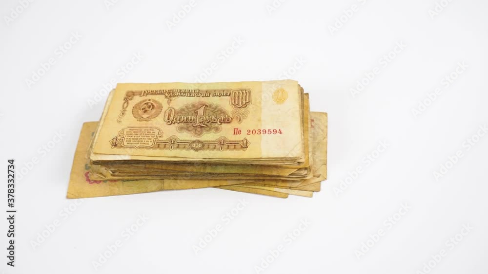 A pack of old Soviet rubles on a white background. Money out of circulation. A pack of old Soviet rubles on a white background. Money out of circulation.