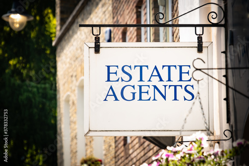 Estate Agents sign in attractive residential area 