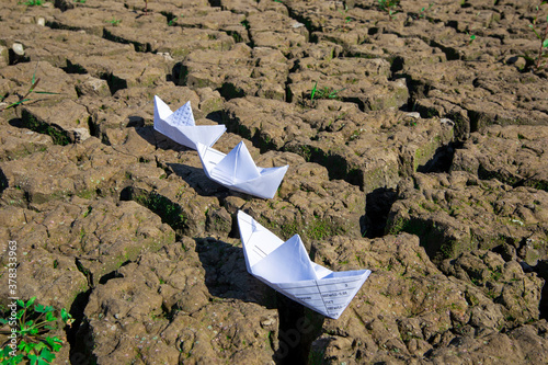 two boats on dry land
