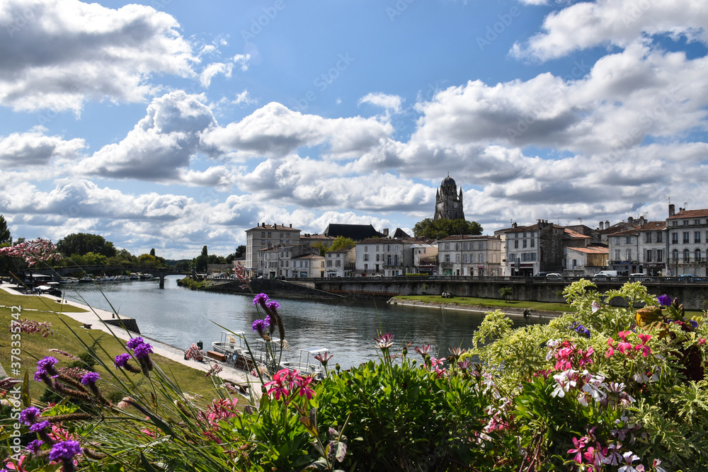the city of Saintes with flowers and the river in the foreground, photography for puzzle
