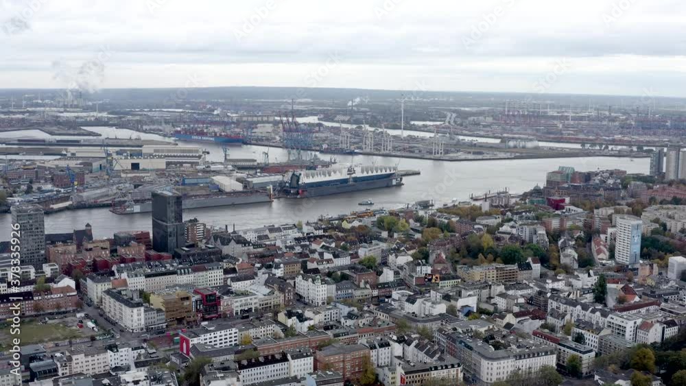 Aerial view of Hamburg city harbor and port in Germany. Hamburg a major port city in northern Germany, is connected to the North Sea by the Elbe River ft. central Altstadt district and town from above Aerial view of Hamburg city harbor and port in Germany. Hamburg a major port city in northern Germany, is connected to the North Sea by the Elbe River ft. central Altstadt district and town from above