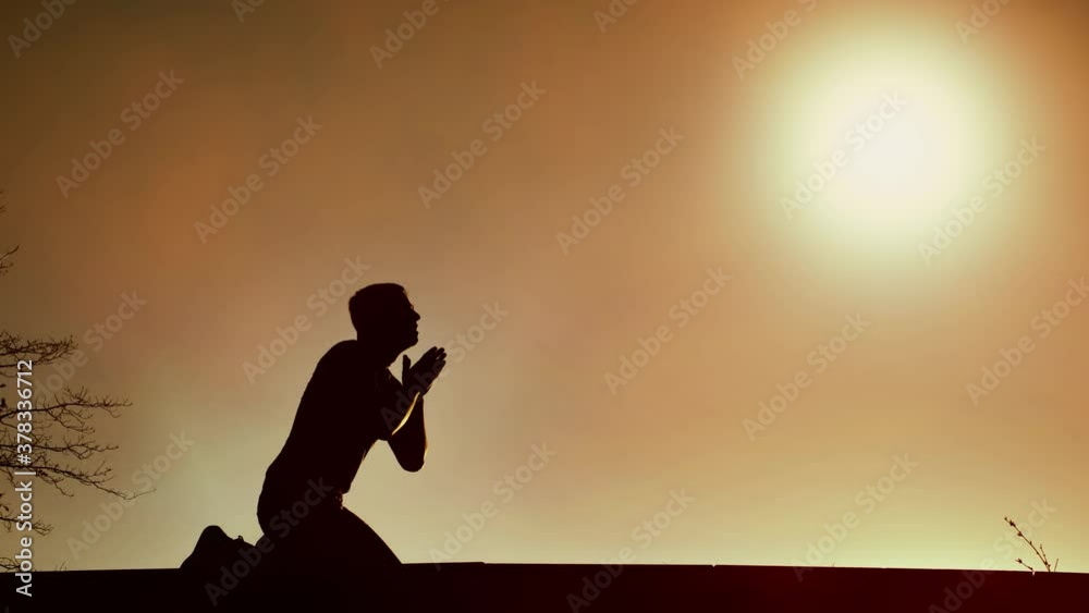 Man falls to his knees cries and prays