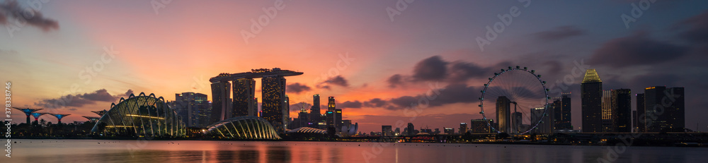 Wide panorama of Cityscape of Singapore Marina bay area at dusk. - obrazy, fototapety, plakaty 