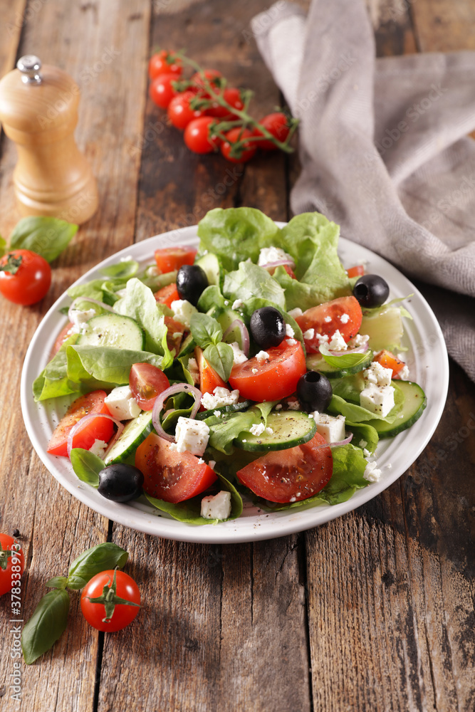 tomato salad with cucumber, lettuce and cheese tomato salad with cucumber, lettuce and cheese