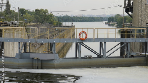 Vyshgorod, Kiev region, Ukraine - September 2020: A pleasure motor ship passes the locks of the Kiev reservoir. The motor ship passes the gateway of the Kiev sea. photo