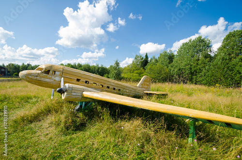 August, 2020 - Morshchinskaya village. Wooden yellow plane. Russia, Arkhangelsk region 