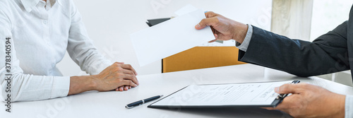 Hand of employer filing final remuneration after employee to write a document letter of resignation, resign concept