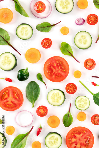 Fresh summer vegetables, a flat lay on a white background, vibrant food pattern, shot from the top