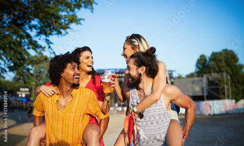 Group of friends having fun time at music festival