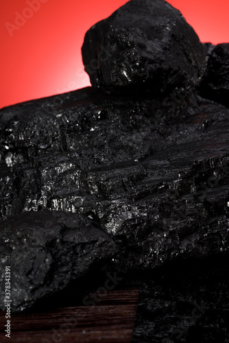 Close-up of a section of a pile of coal, fine black coal section texture