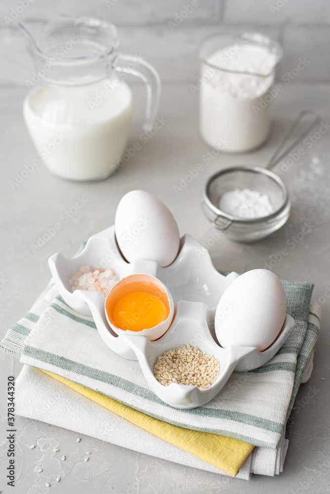 white eggs and egg yolk on a ceramic stand white eggs and egg yolk on a ceramic stand