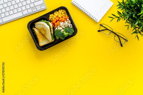 Odering food online delivery to office or home. Luch boxes on workplace photo