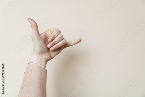 Woman's hand showing surf gesture isolated