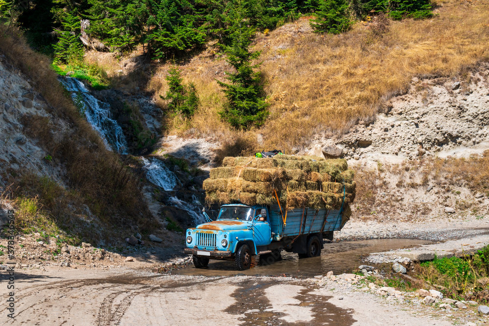 Truck loaded with hay rides on goderdzi pass, Ajara