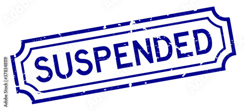 Grunge blue suspended word rubber seal stamp on white background