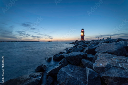 Night view of lighthouse of Warnemuende on the Baltic Sea (Germany)