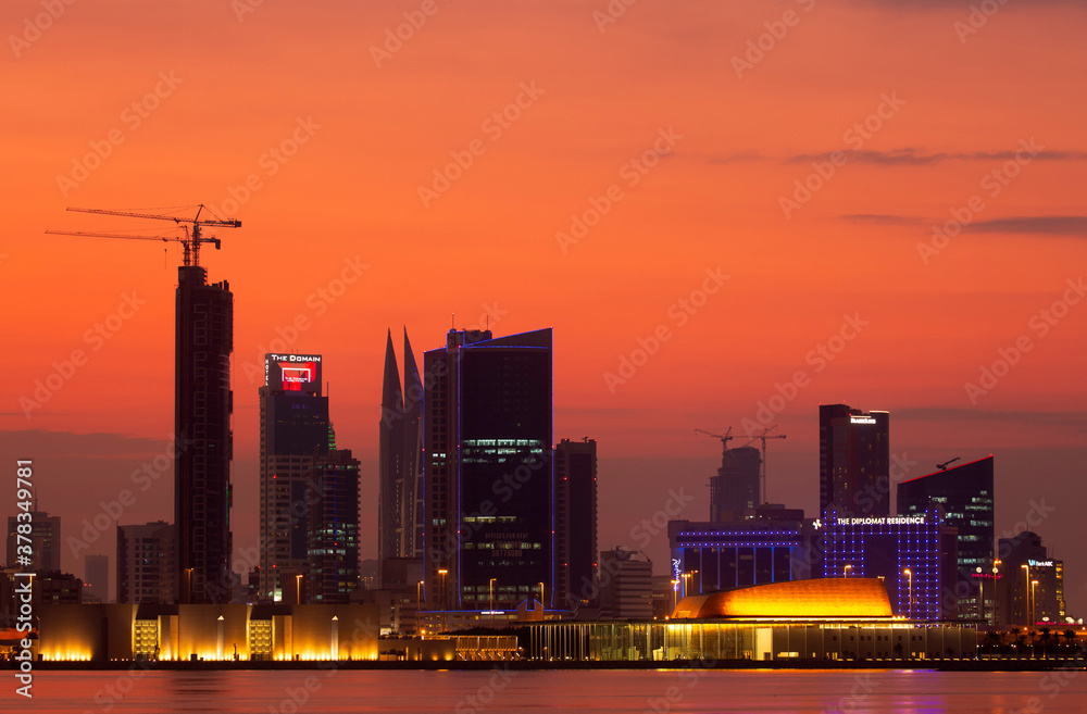 MANAMA , BAHRAIN - NOVEMBER 25: Bahrain skyline with illuminated iconic buildings and dramatic hue in the sky on 25 November, 2019, Manama, Bahrain.