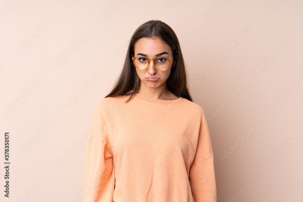 Young girl over isolated background sad Young girl over isolated background sad