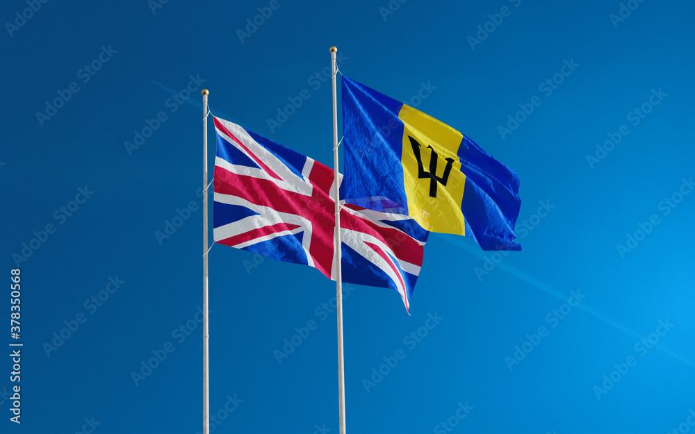 UK and Barbados Island flags waving against a cloudy sky background. Barbados to remove Queen Elizabeth as head of state 2020 UK and Barbados Island flags waving against a cloudy sky background. Barbados to remove Queen Elizabeth as head of state 2020