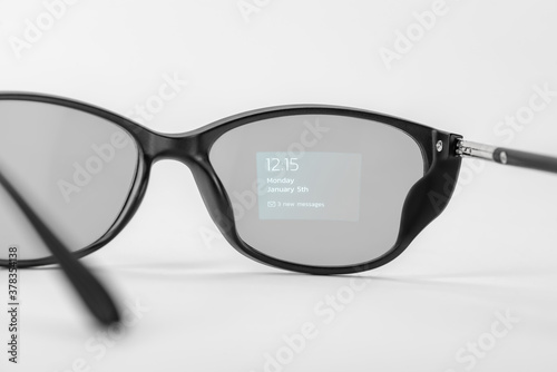 Time, date and notification projected on smart glasses' lens